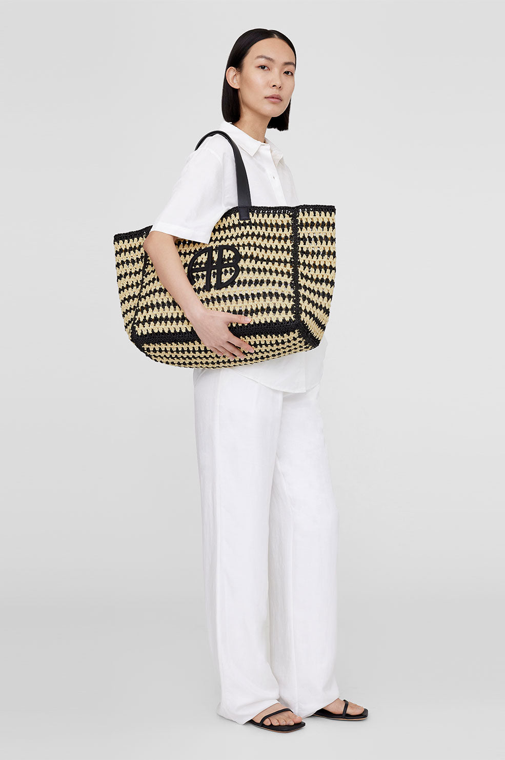 ANINE BING Large Rio Tote - Black And Natural Stripe - On Model Front