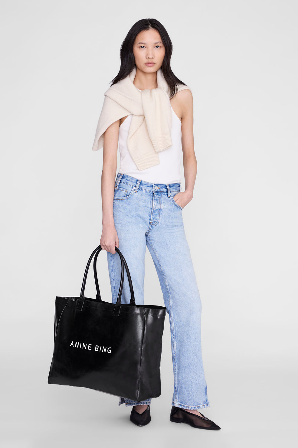 ANINE BING Leo Coated Canvas Tote - Black - on model front