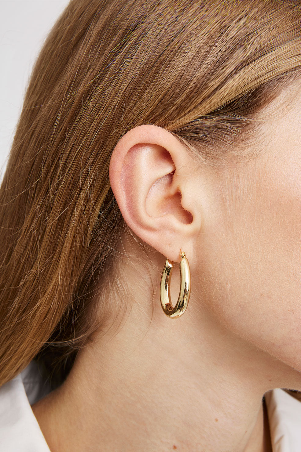 ANINE BING Tubular Oval Hoop Earrings - 14K Gold - On Model View